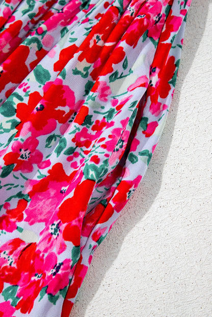 Robe longue bleu ciel à fleurs manches lanterne et taille smockée à volants