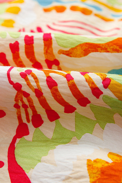 Robe à bretelles spaghetti avec passepoils imprimé abstrait orange