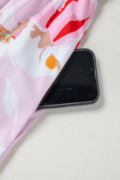 Robe longue smockée à épaules nouées imprimé floral rose