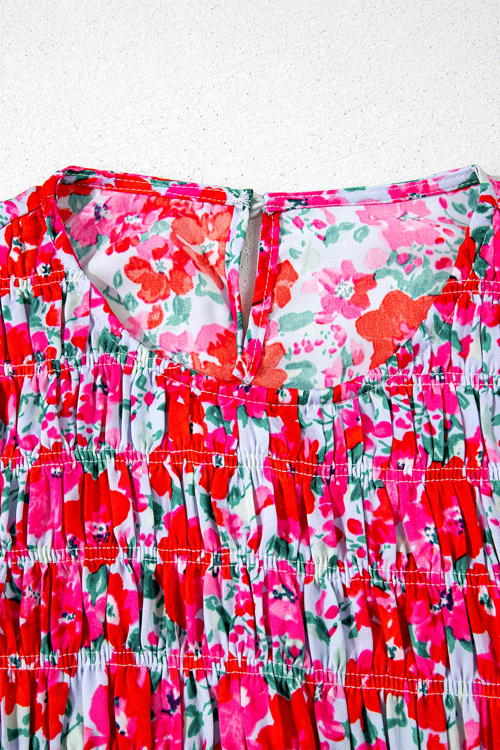 Robe longue bleu ciel à fleurs manches lanterne et taille smockée à volants
