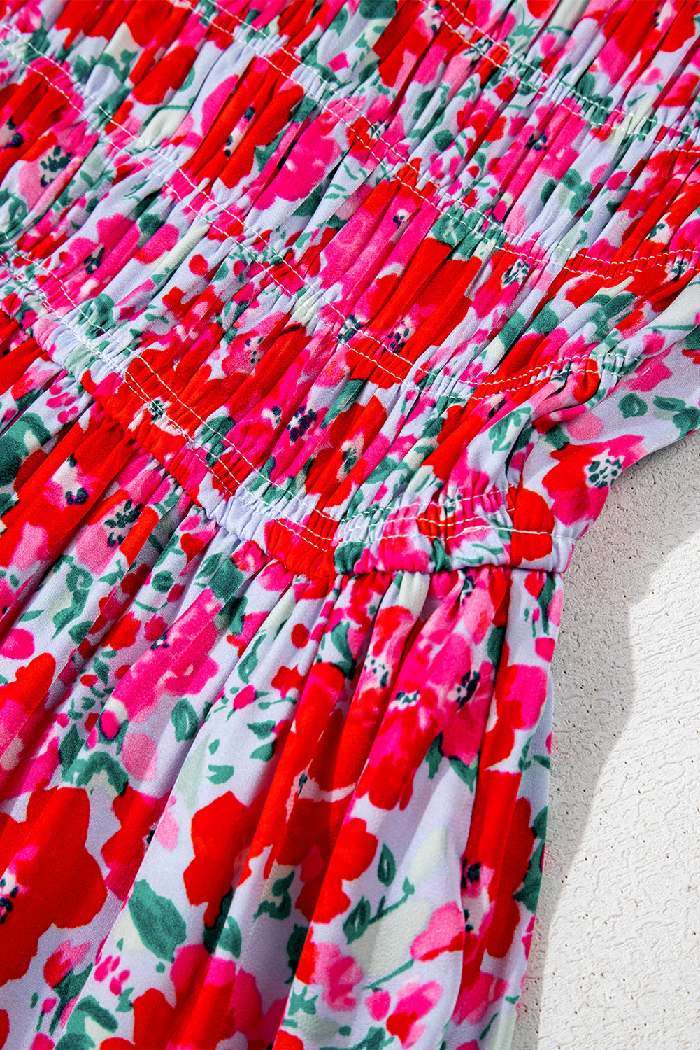 Robe longue bleu ciel à fleurs manches lanterne et taille smockée à volants
