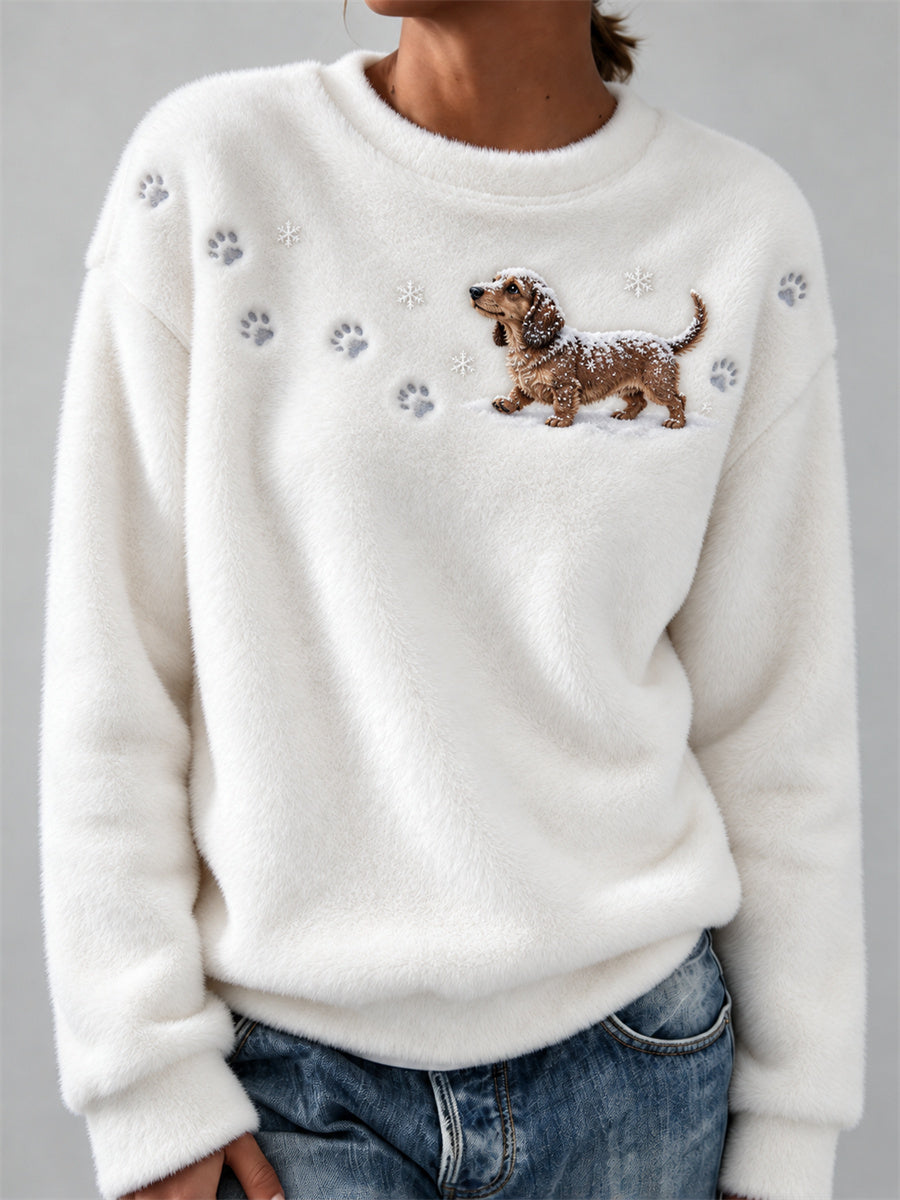 Femme Teckel Chien dans la neige Empreintes de pattes et flocons de neige Imprimer Cozy Flannel Sweatshirt